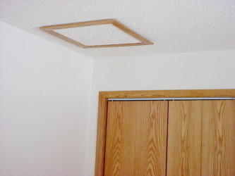 Front bedroom closet and attic entry