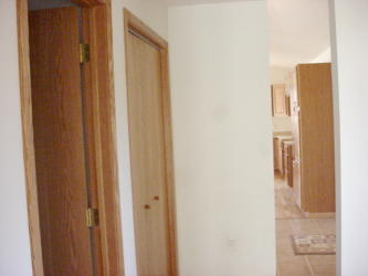 Hallway view of Bathroom Doorway, Closet and Kitchen